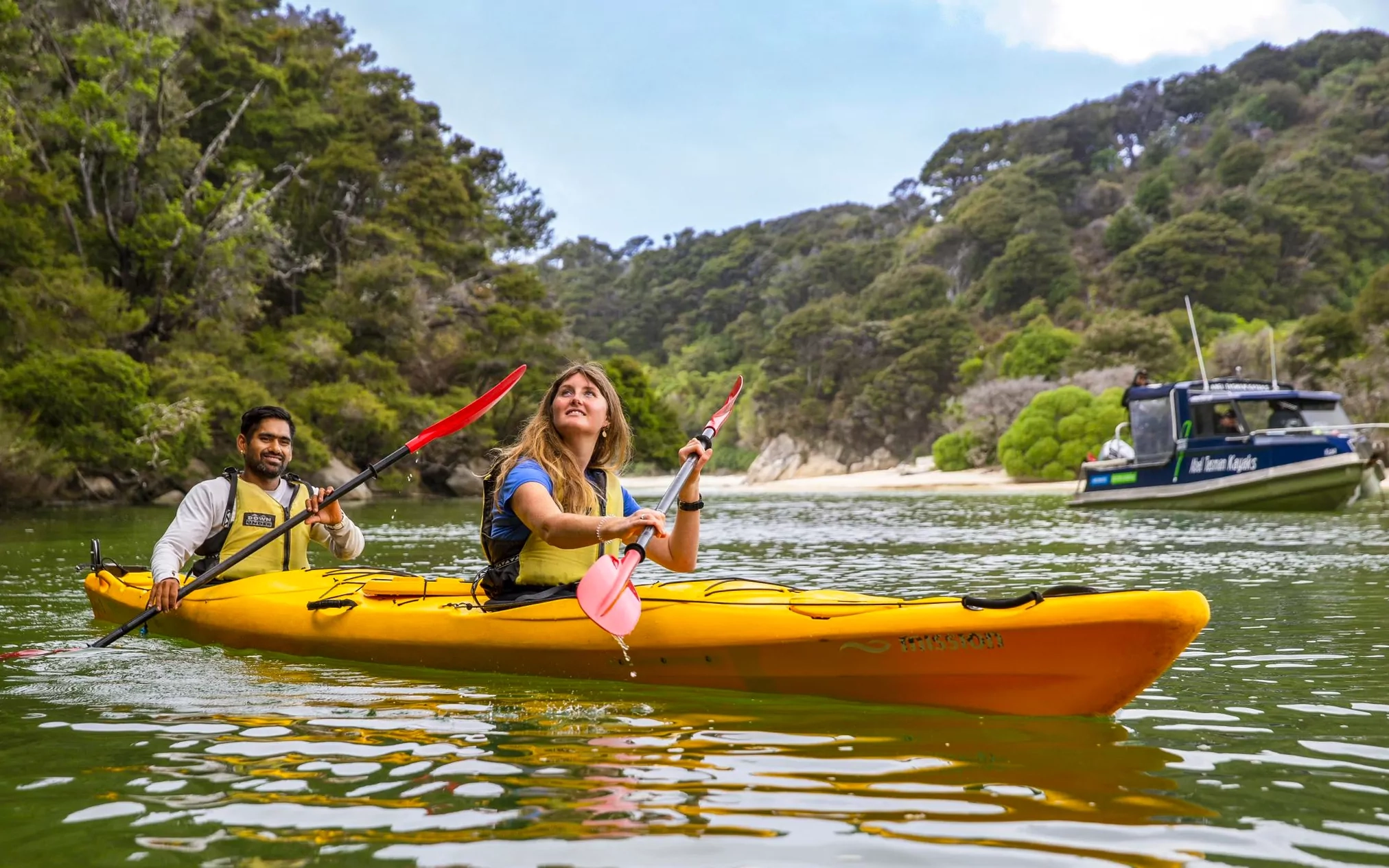 Couple kayaking by Abel Tasman Kayaks