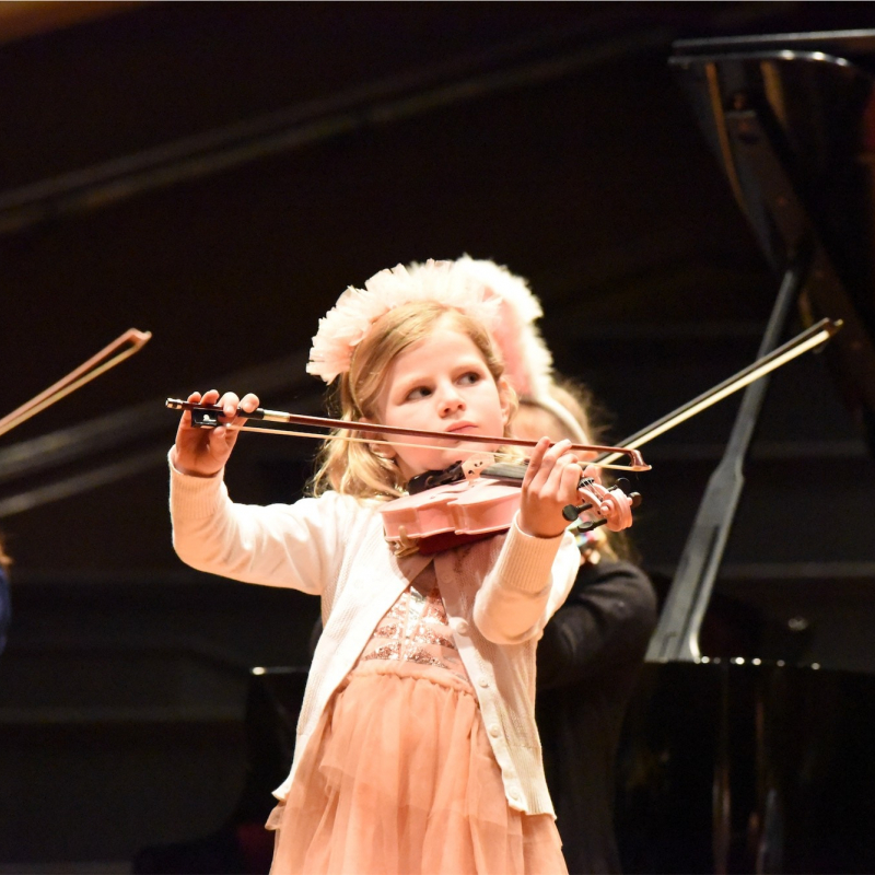 tiny girl playing violin in pink credit ncma