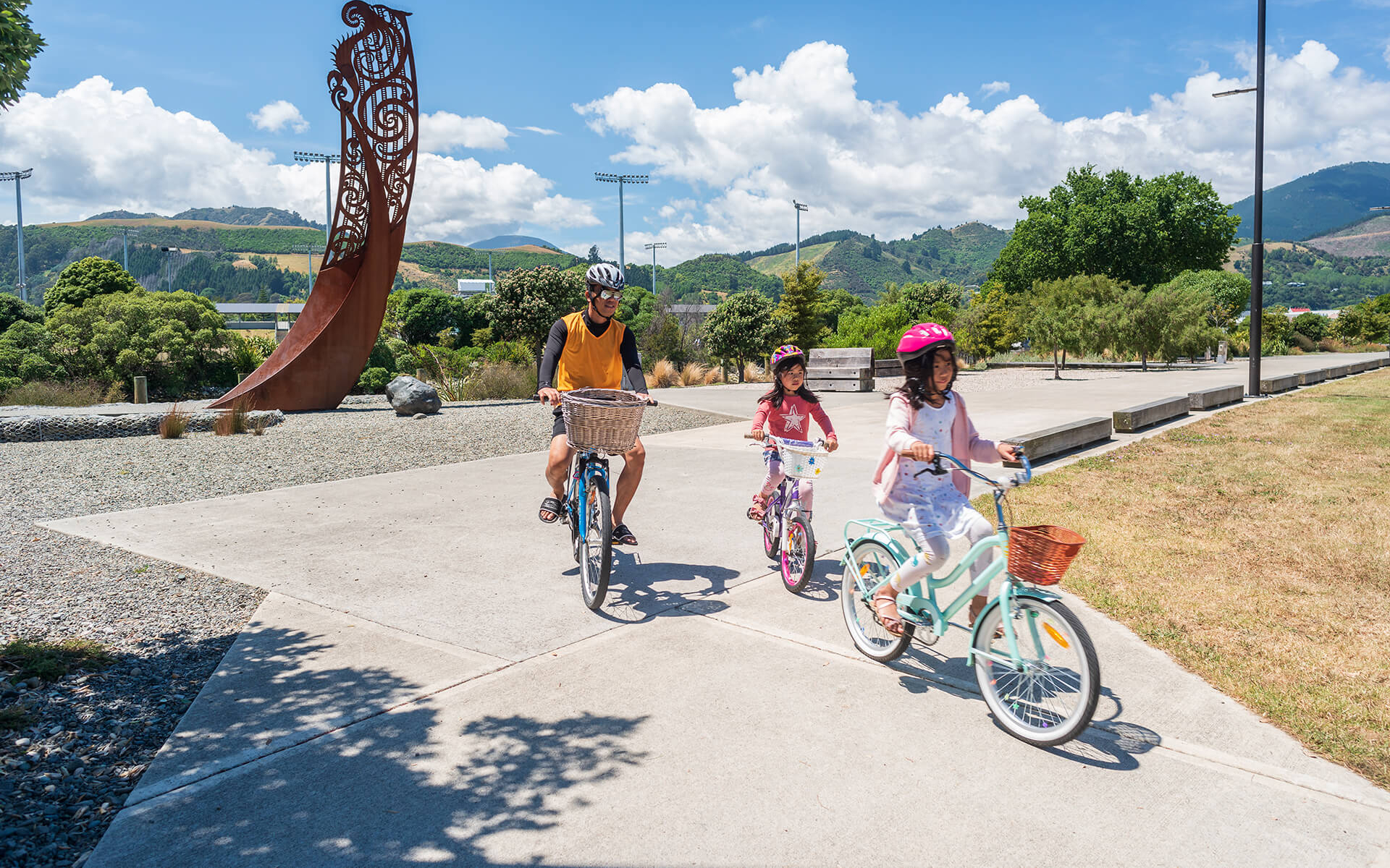 Family cycling around Nelson Matai River Walkway by Oliver Weber